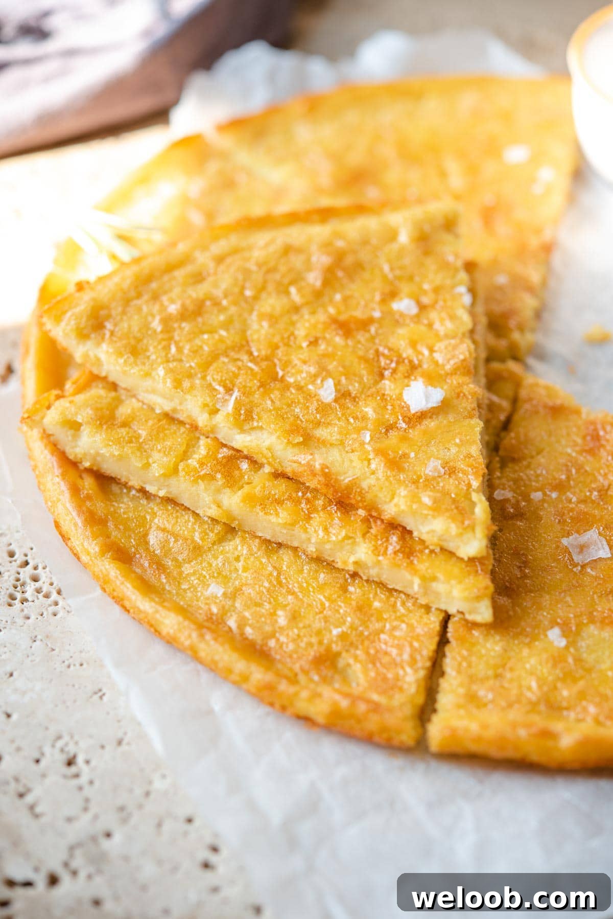 A close up of two slices of Italian farinata flatbread