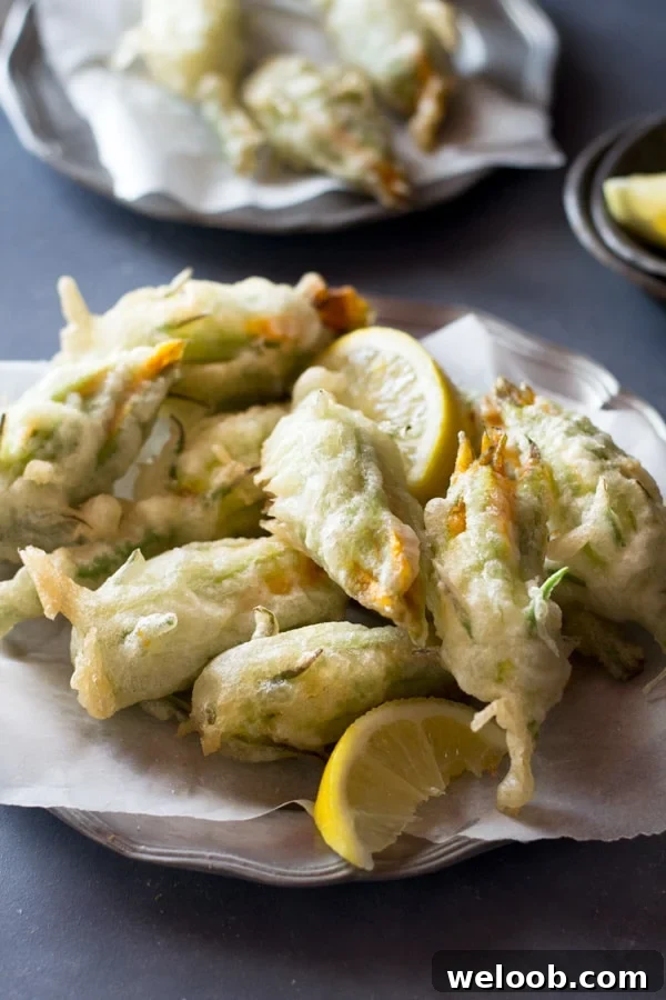 Crispy fried zucchini flowers stuffed with ricotta, chili flakes and lemon Inside the rustic kitchen