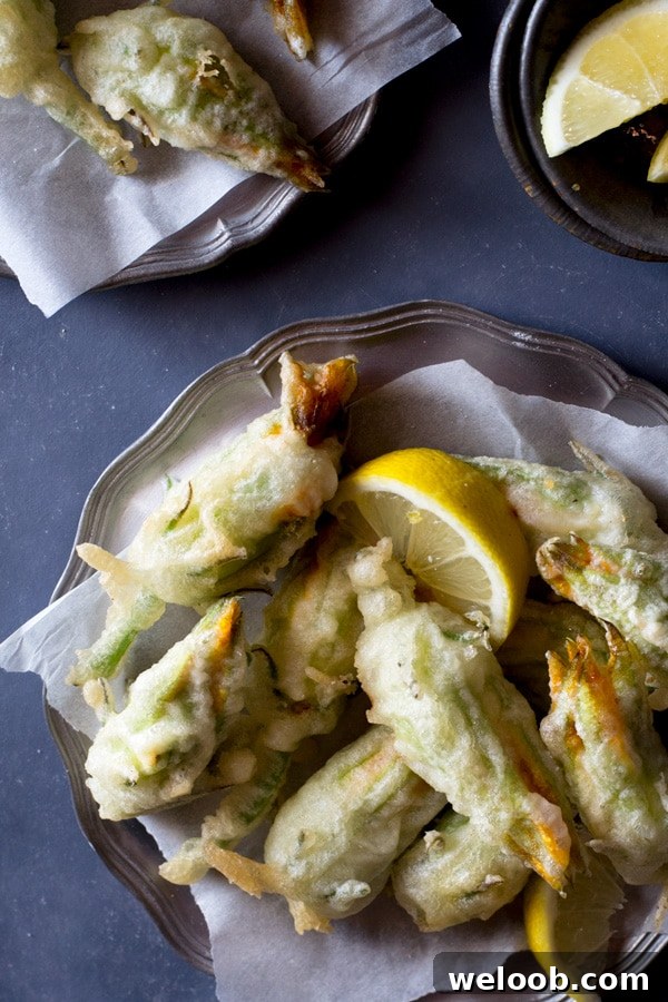 Crispy fried zucchini flowers stuffed with ricotta, chili flakes and lemon Inside the rustic kitchen