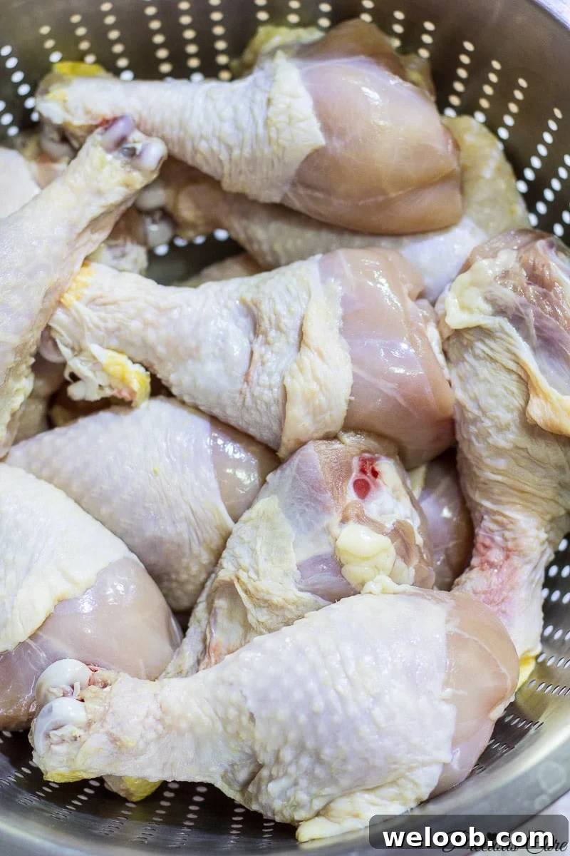 Chicken drumsticks in a porous pan.