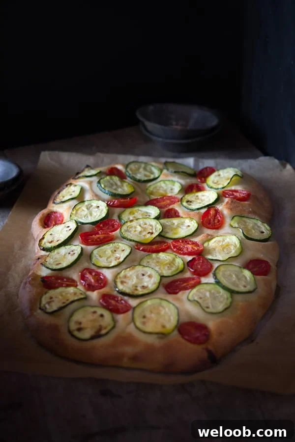 zucchini tomato focaccia inside the rustic kitchen