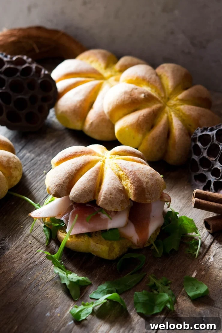 pumpkin bread rolls filled with prosciutto and arugula more pumpkin shaped rolls in the background