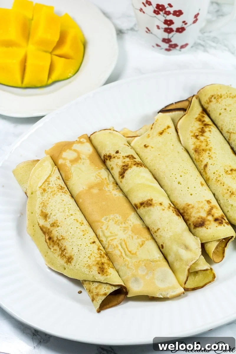 Large plate of rolled Cameroonian pancakes.