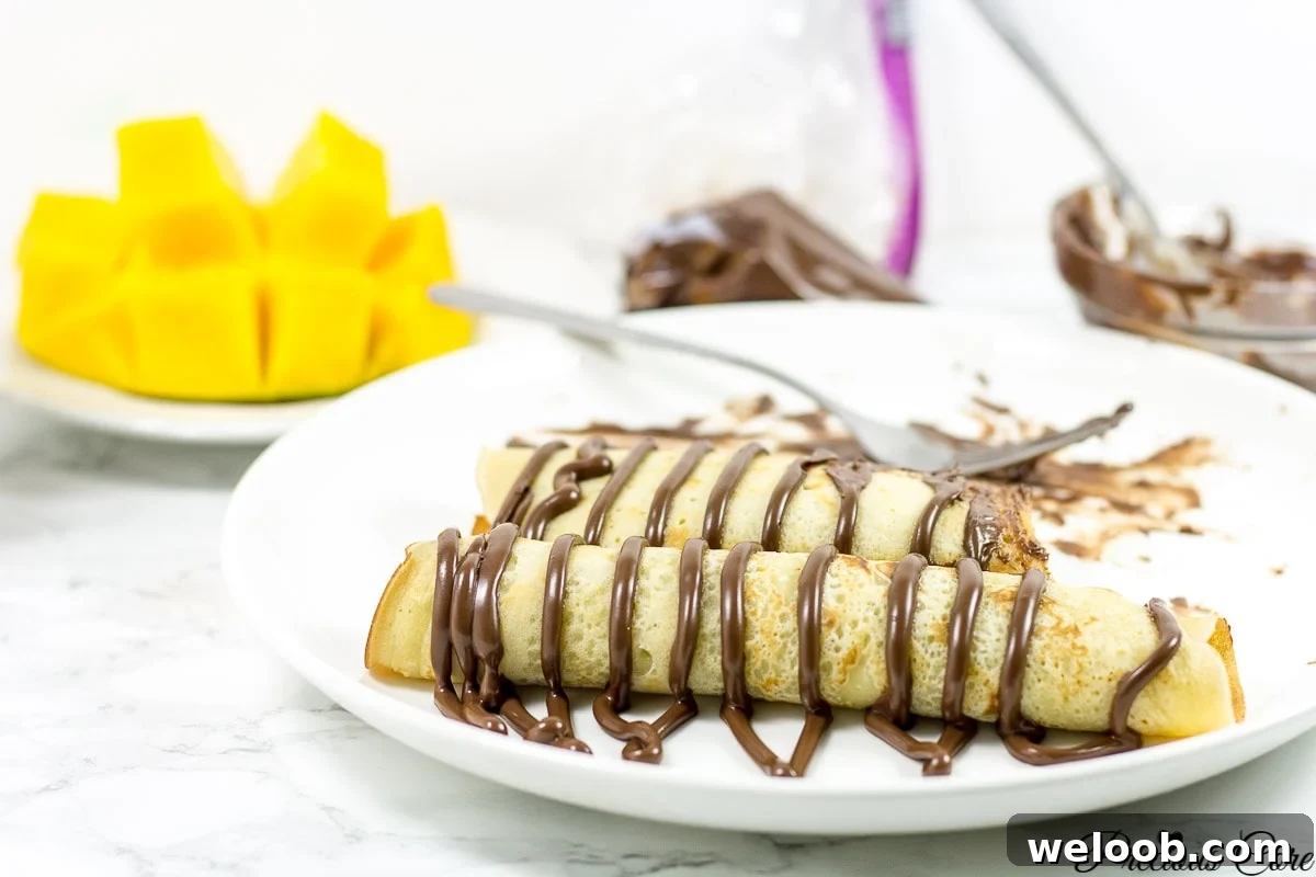 Cameroonian pancakes drizzled with chocolate.