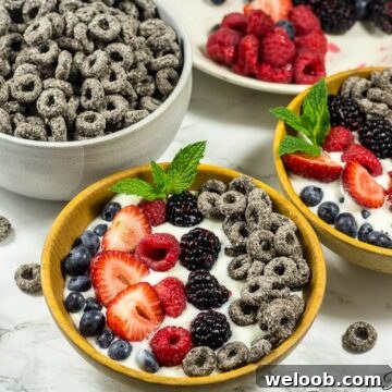 Two mixed berry parfait bowls.