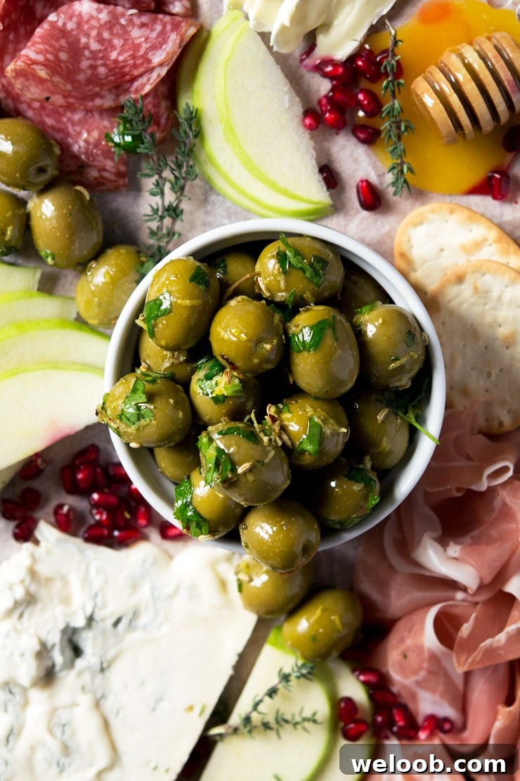 A close up of marinated olives in a ramekin 