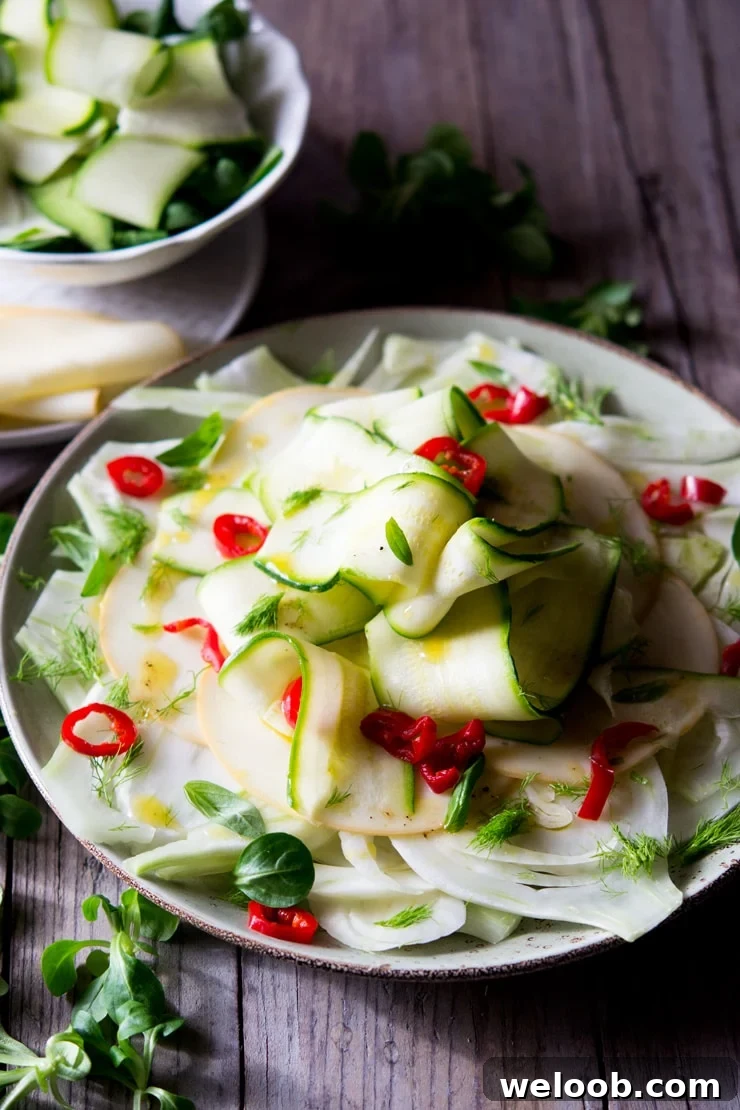 A large plate of courgette salad with fennel and smoked scamorza cheese