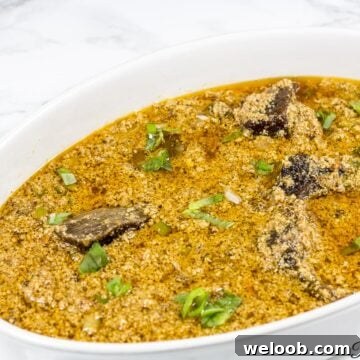 White, oblong bowl of Edusi stew.