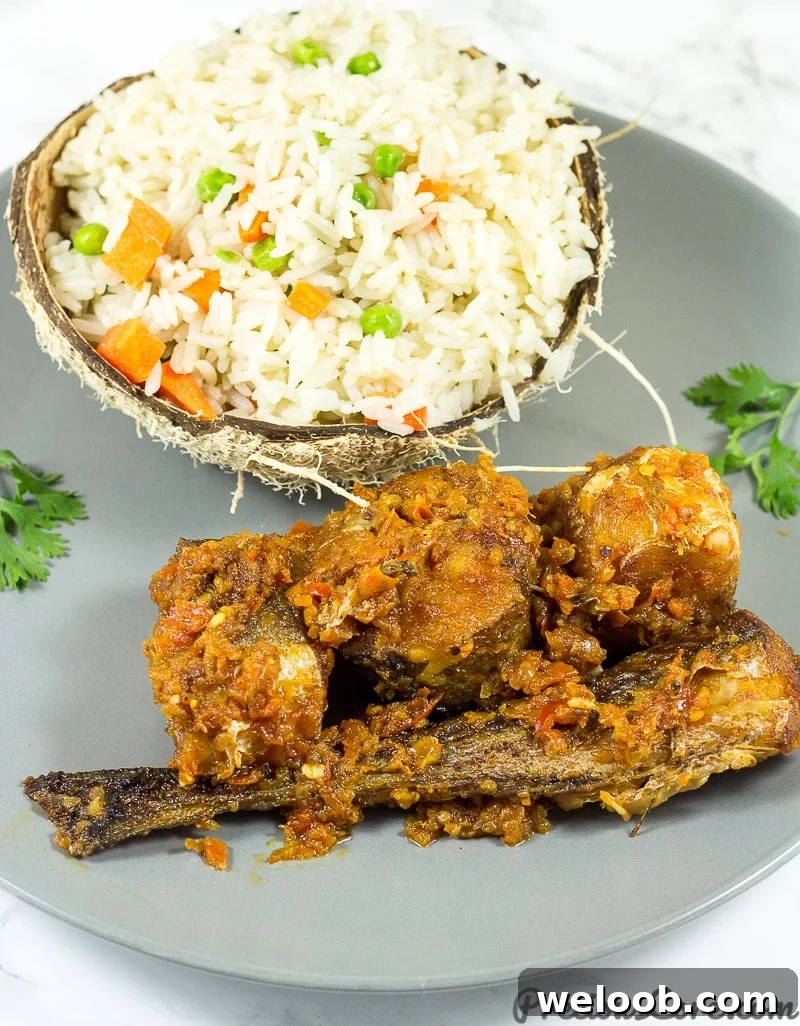 Coconut rice served with peppered fish