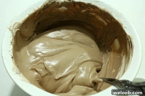 Folding chocolate into cream
