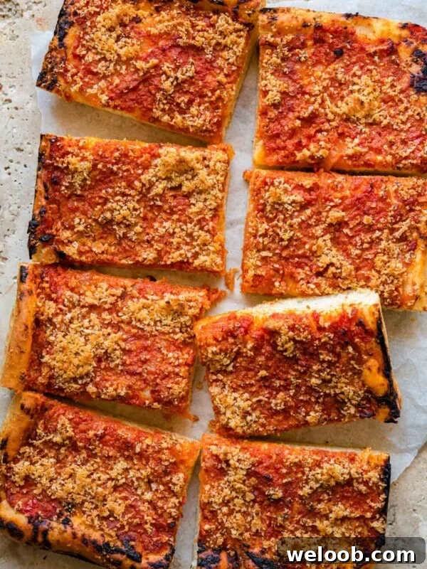 An overhead shot of a pan pizza cut into slices