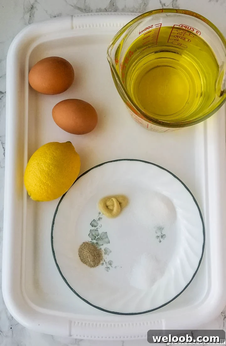 Ingredients for mayonnaise on a tray.