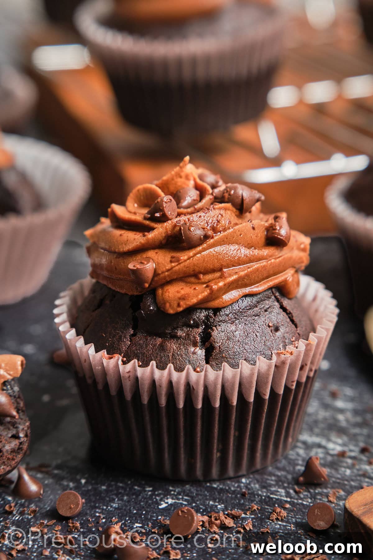 Zoom-in on a chocolate cupcake with chocolate frosting.