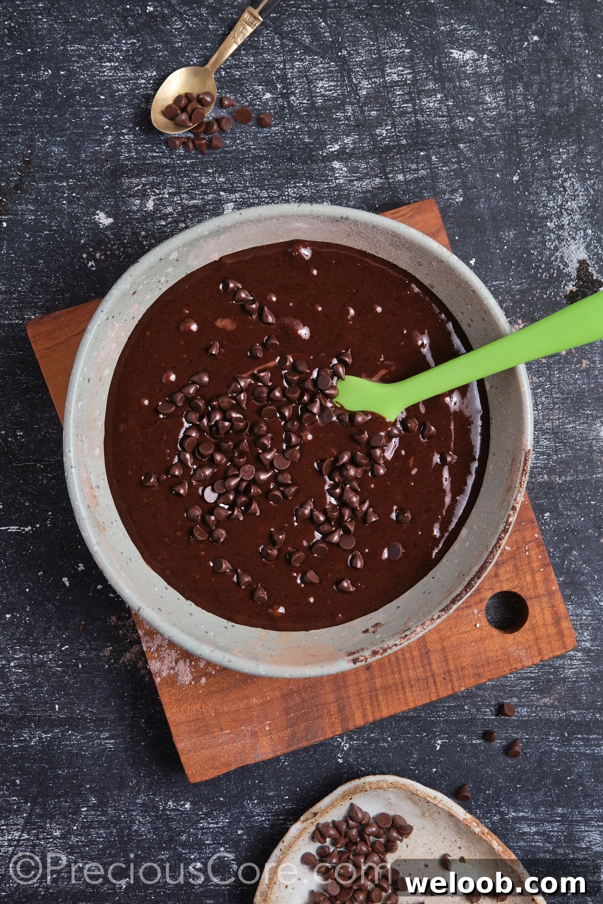 Wet ingredients mixed in with dry ingredients and chocolate chips added.