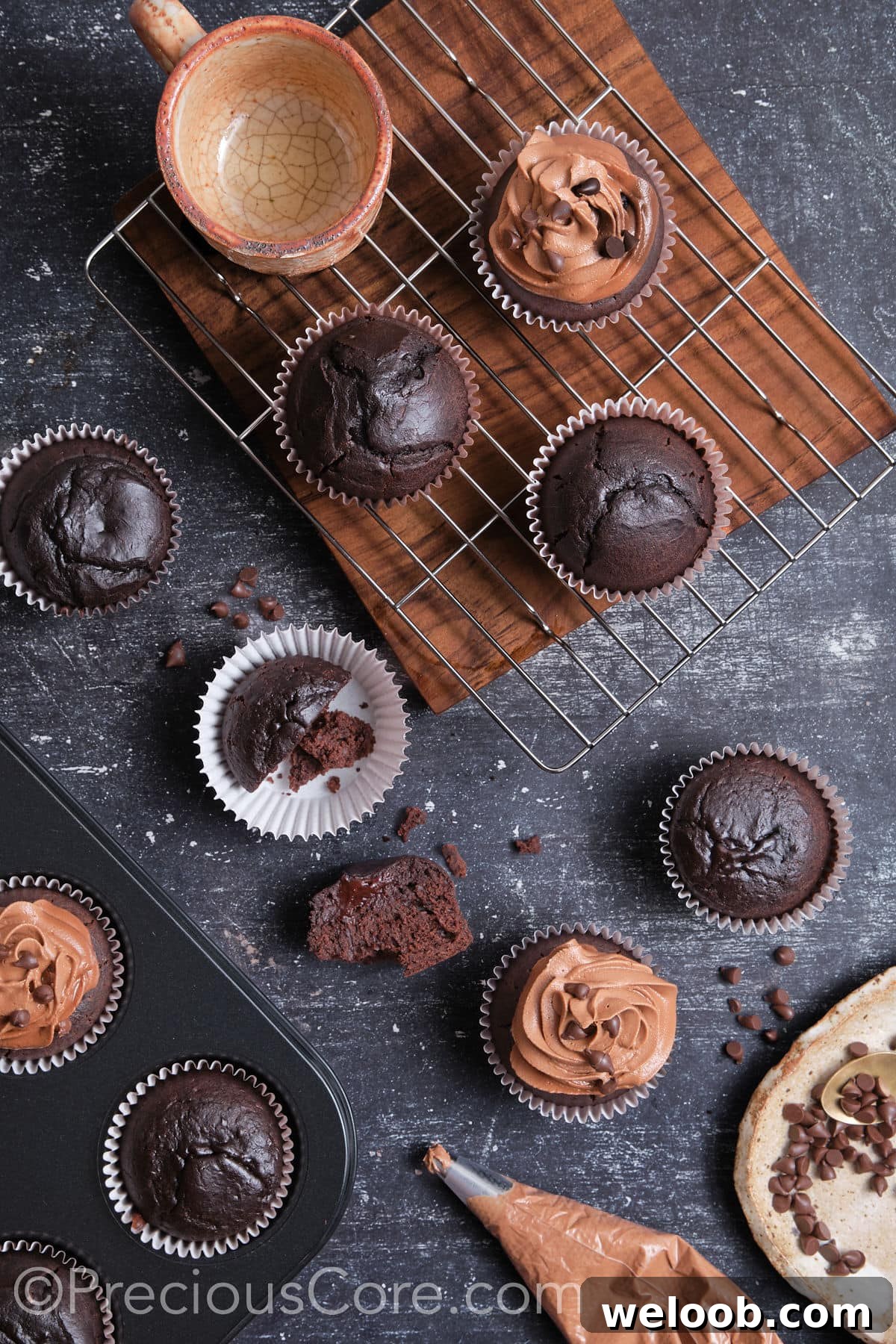 Frosting easy moist chocolate cupcakes.
