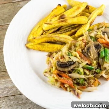 Cameroonian Cabbage Stew served with baked plantain fries.