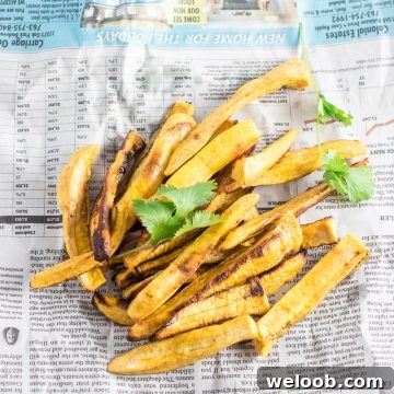 Fries on a newspaper.