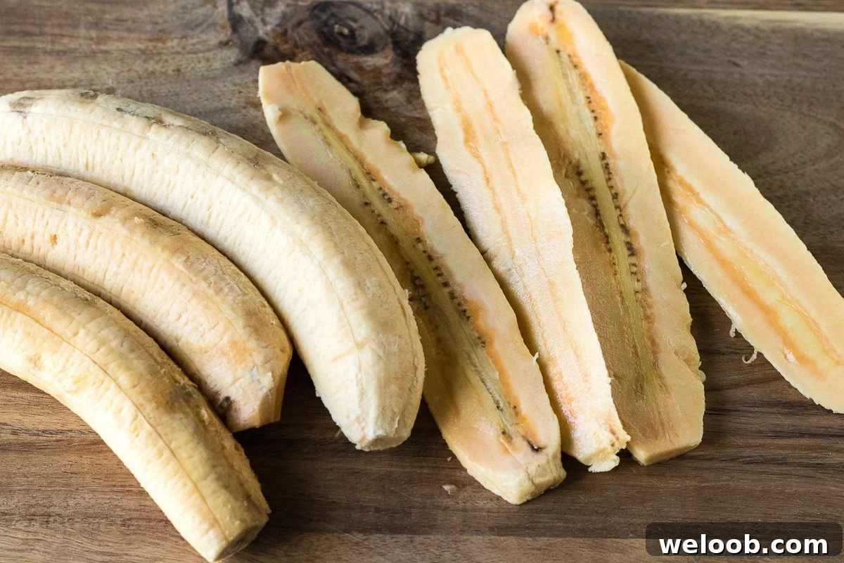 SlicIng plantains lengthwise.