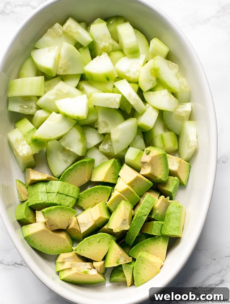 Chopped Cucumber Avocado Salad ingredients in a bowl
