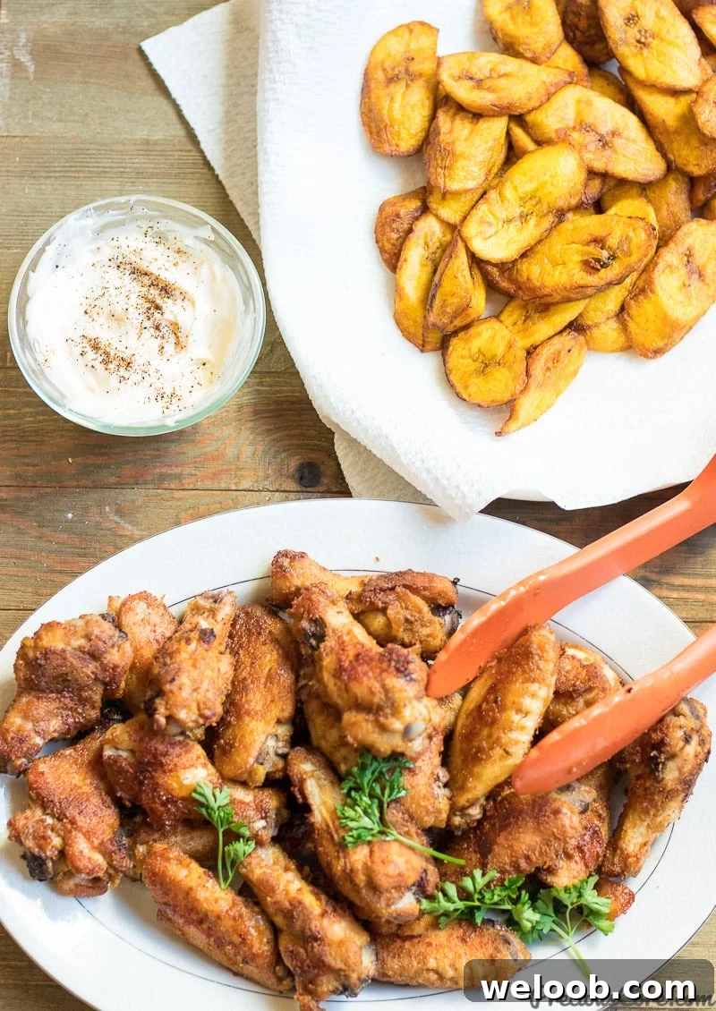 oven grilled chicken wings served with sweet fried plantains and herby mayo