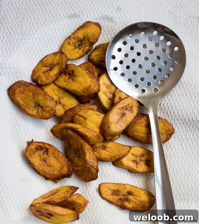 Golden brown sweet fried plantains on paper towels.