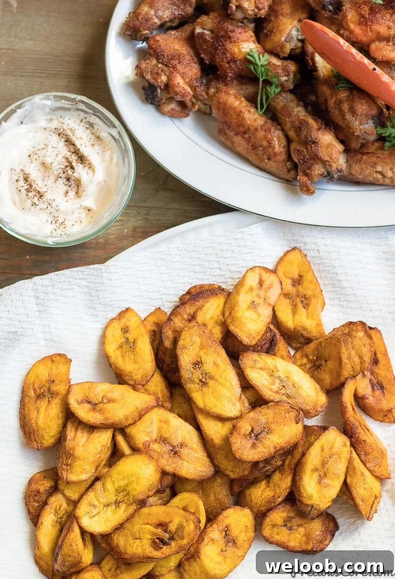 Fried plantains served with chicken wings.