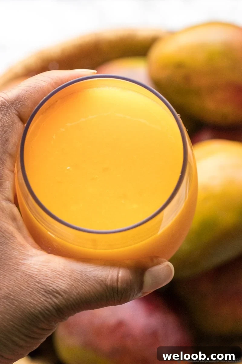 A cup of homemade mango juice