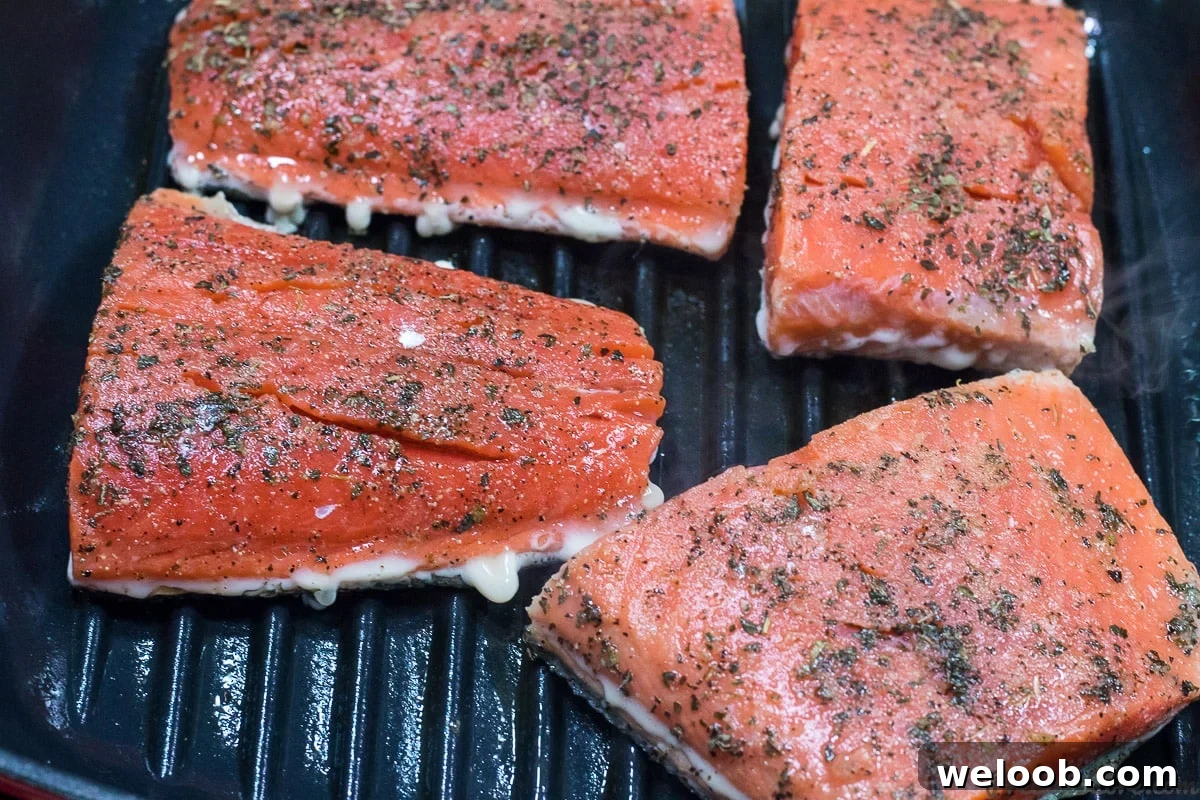 Grilling salmon in pan