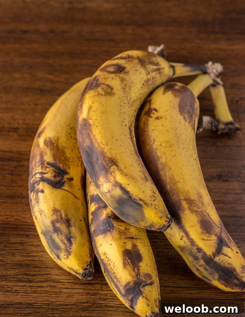 Overripe bananas with black spots.