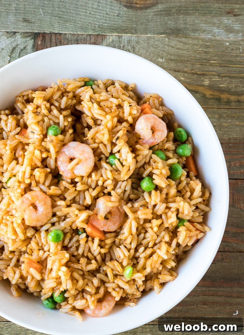 A plate of Jollof Rice with Shrimp. African Dinner Recipe.