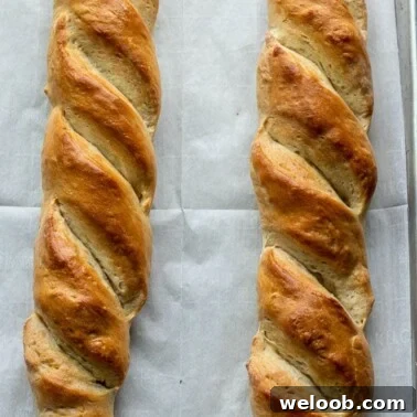 French bread loaves on large baking sheet