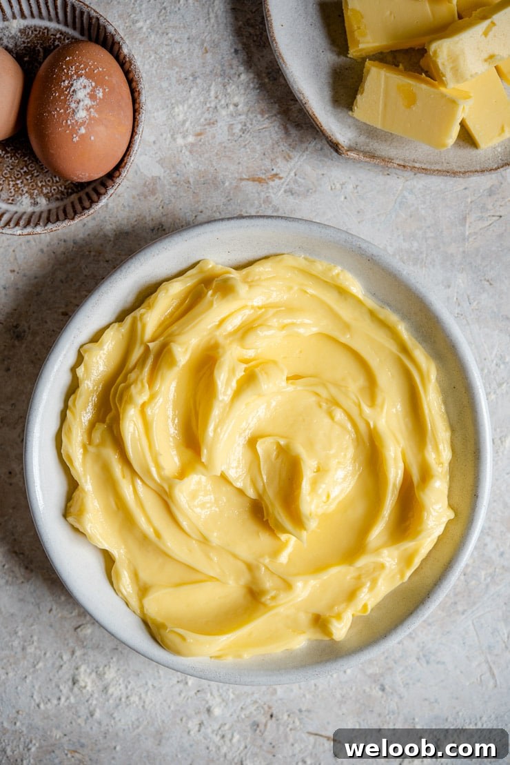 An overhead shot of softened butter in a bowl