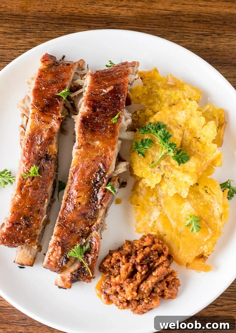 Tostones on a plate with meat.