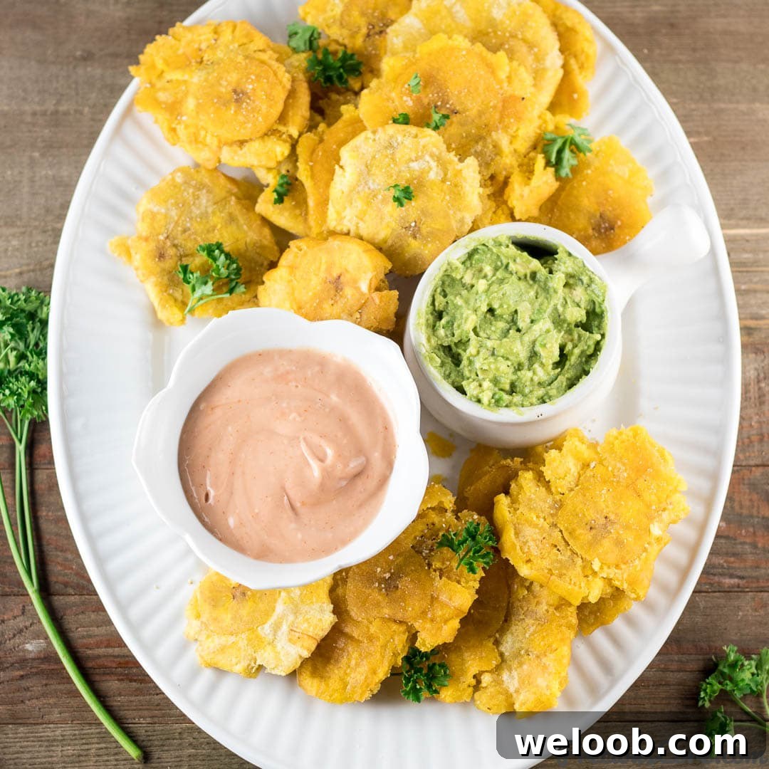 Tostones on a plate with dips.