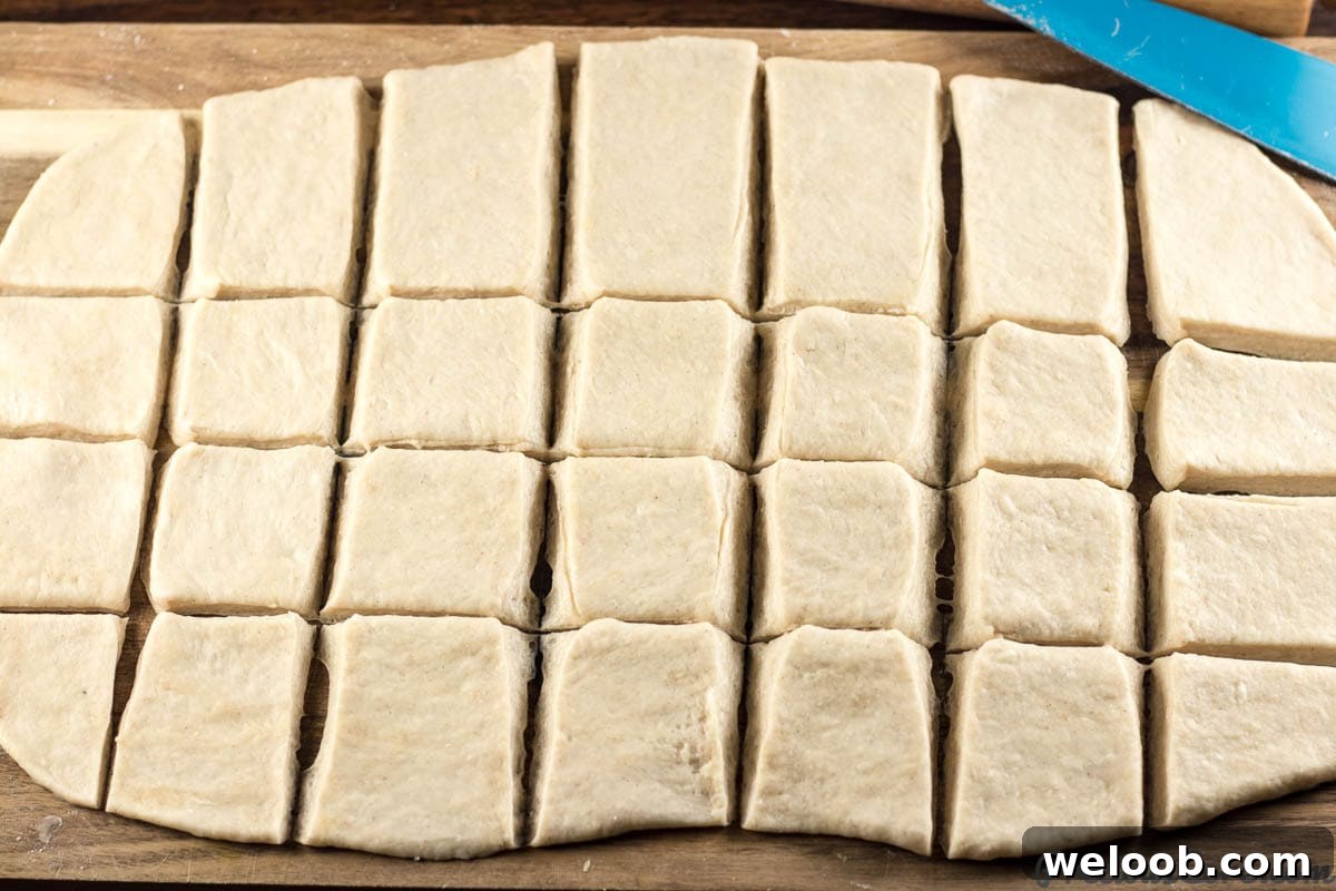 Mandazi dough cut into pieces.