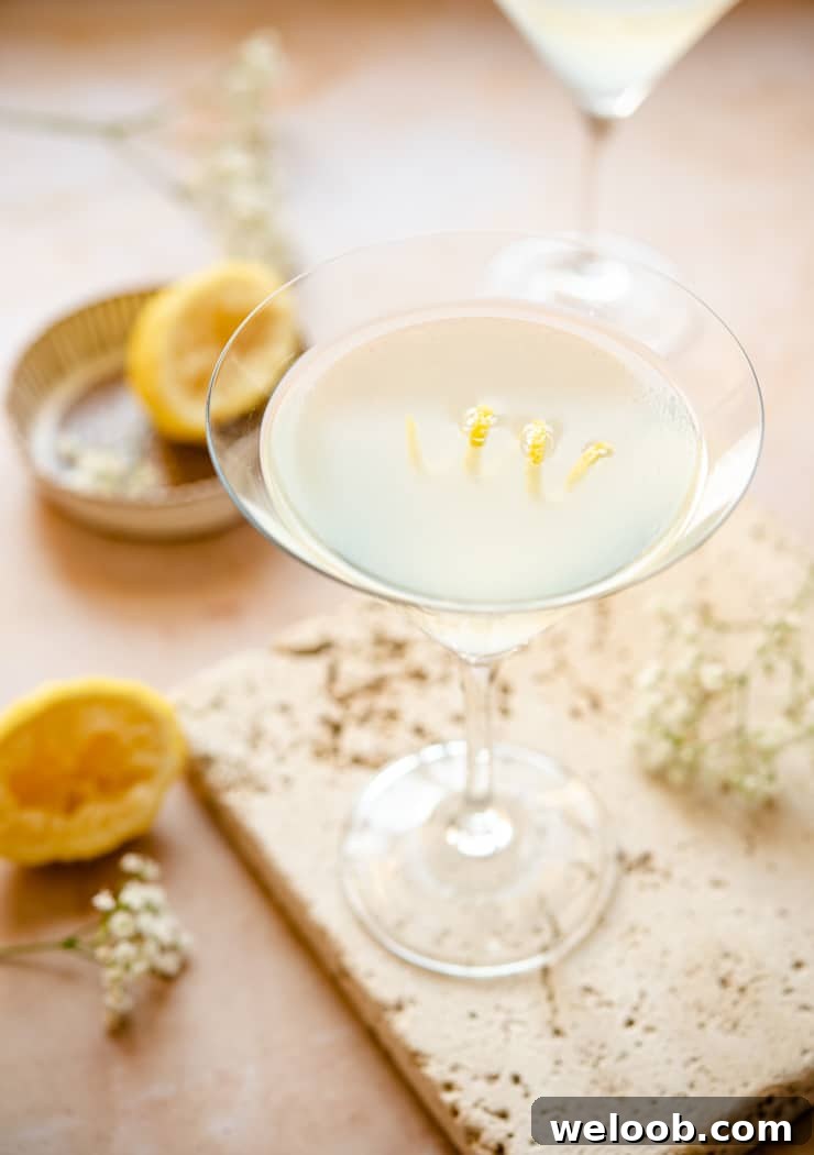 Limoncello martini in a martini glass with lemon peel garnish