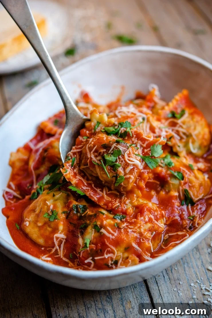 Homemade ravioli tossed with tomato sauce in a bowl