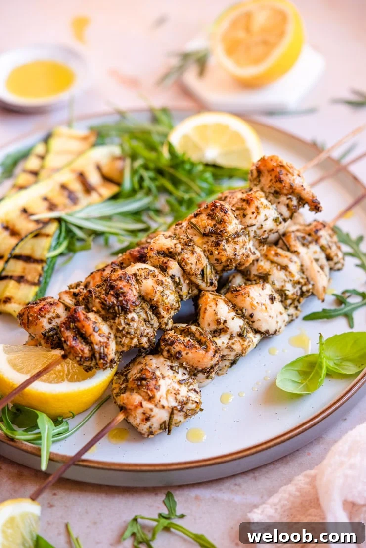 A side shot of 3 chicken spiedini stacked on top of each other