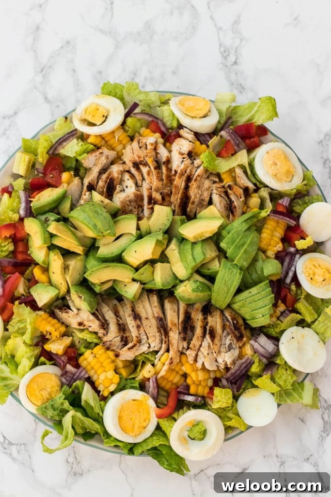Healthy chicken avocado salad on platter