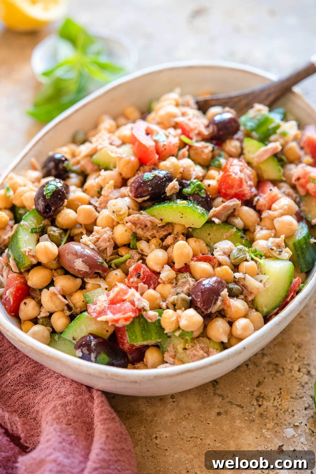 A side shot of a chickpea tuna salad in a large bowl