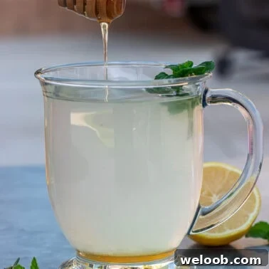 Square image of honey lemon tea.
