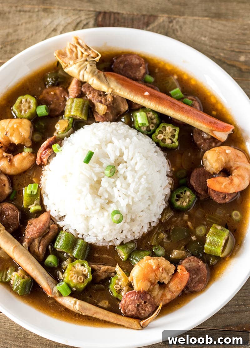 Seafood Gumbo and rice on a plate.