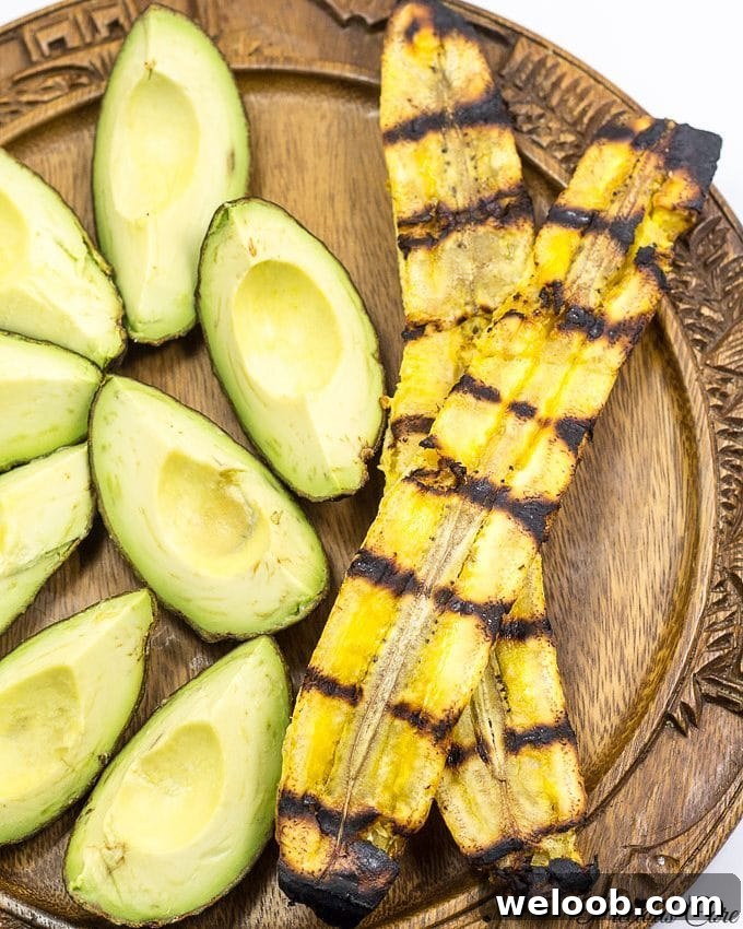 Plate with grilled plantains and avocado wedges