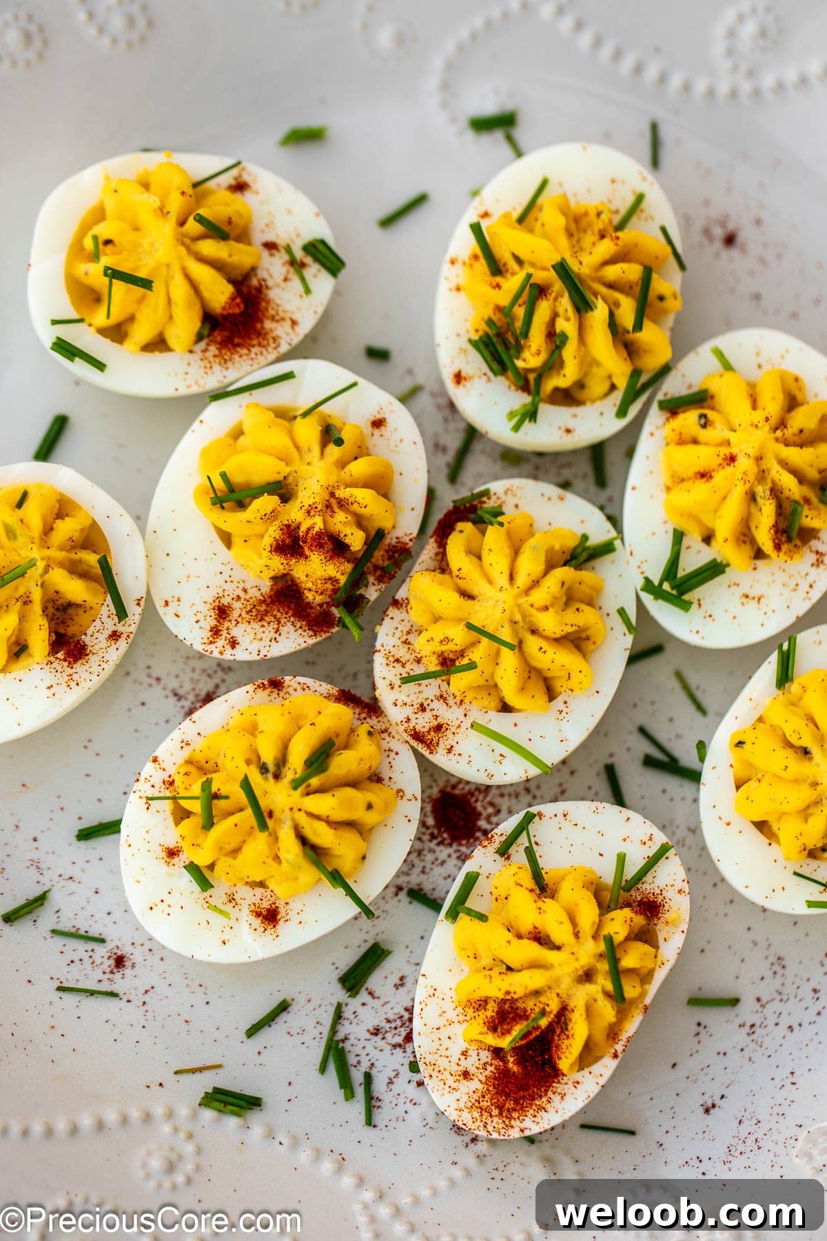 Deviled eggs with paprika and herbs.