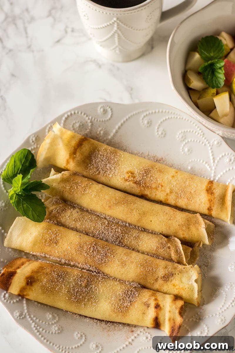 Perfect French Crepes: Thin, Tender, and Ready in Minutes 2 Crepes Served with diced apples and pears in a bowl and coffee