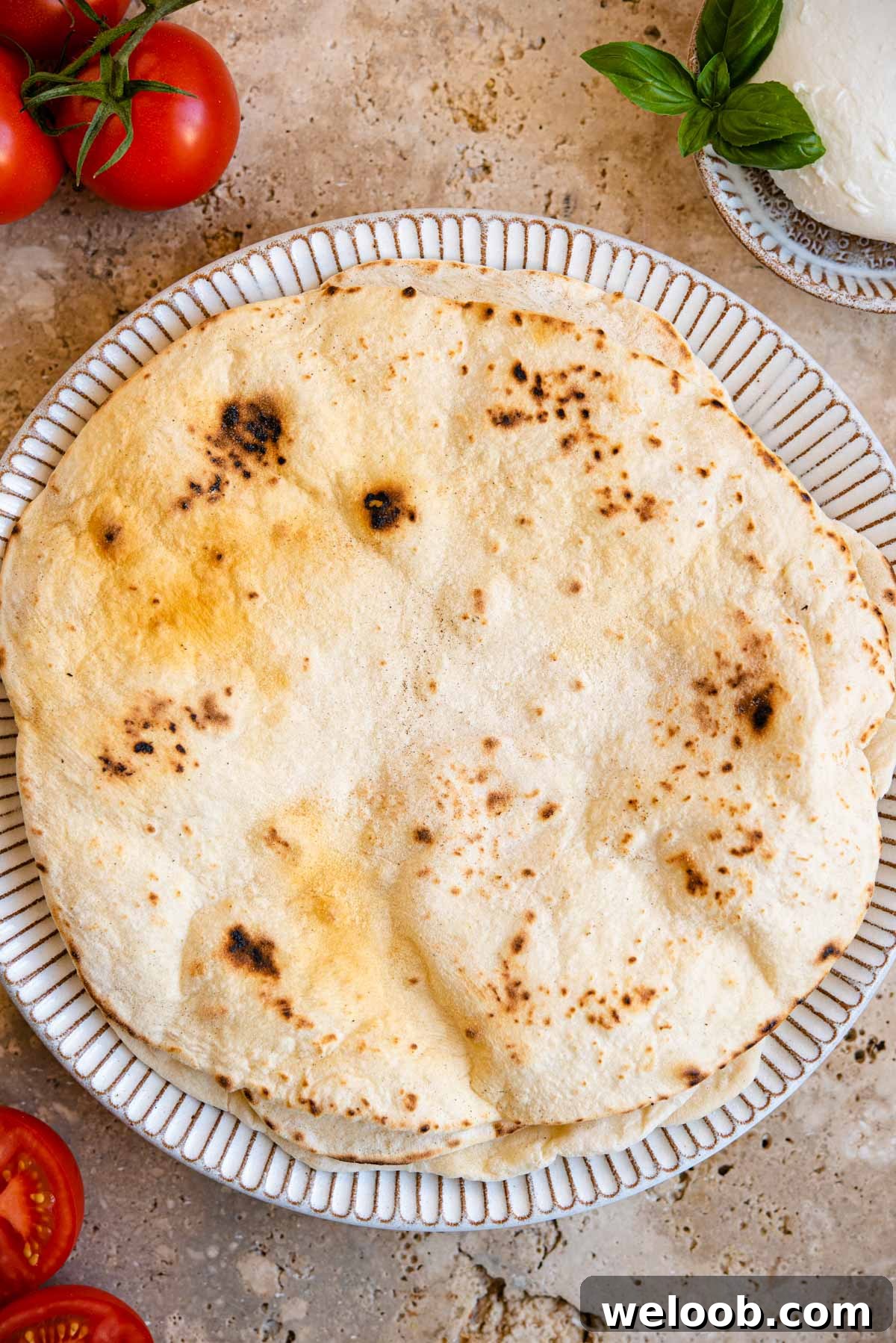 An overhead shot of Italian flatbreads on a rustic plate
