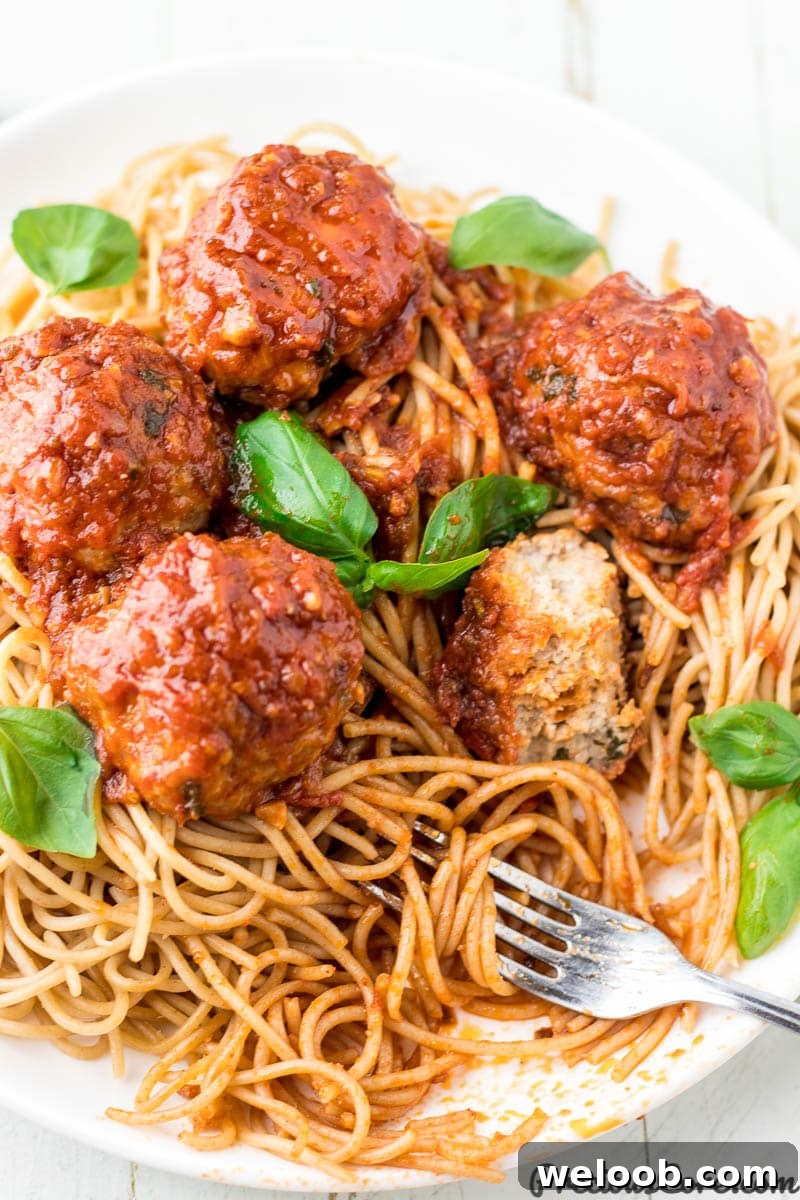 Juicy Baked Chicken Meatballs with Garlic Parmesan Sauce 5 chicken meatballs with spaghetti