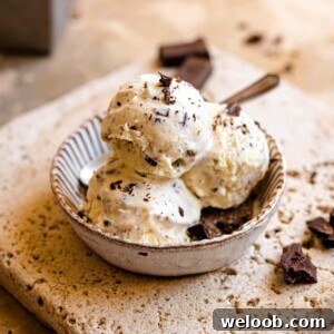 A square image of 3 scoops of ice cream in a rustic dish