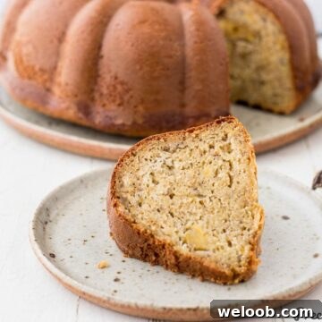 Slice of plantain cake on speckled plate