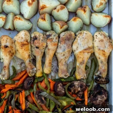 Roasted chicken, potatoes and veggies on a sheet pan